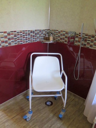 This Height Adjustable Mobile Shower Chair has a braced frame for strength and stability, and is made from durable coated steel. This Height Adjustable Mobile Shower Chair has a braced frame for strength and stability, and is made from durable coated steel.